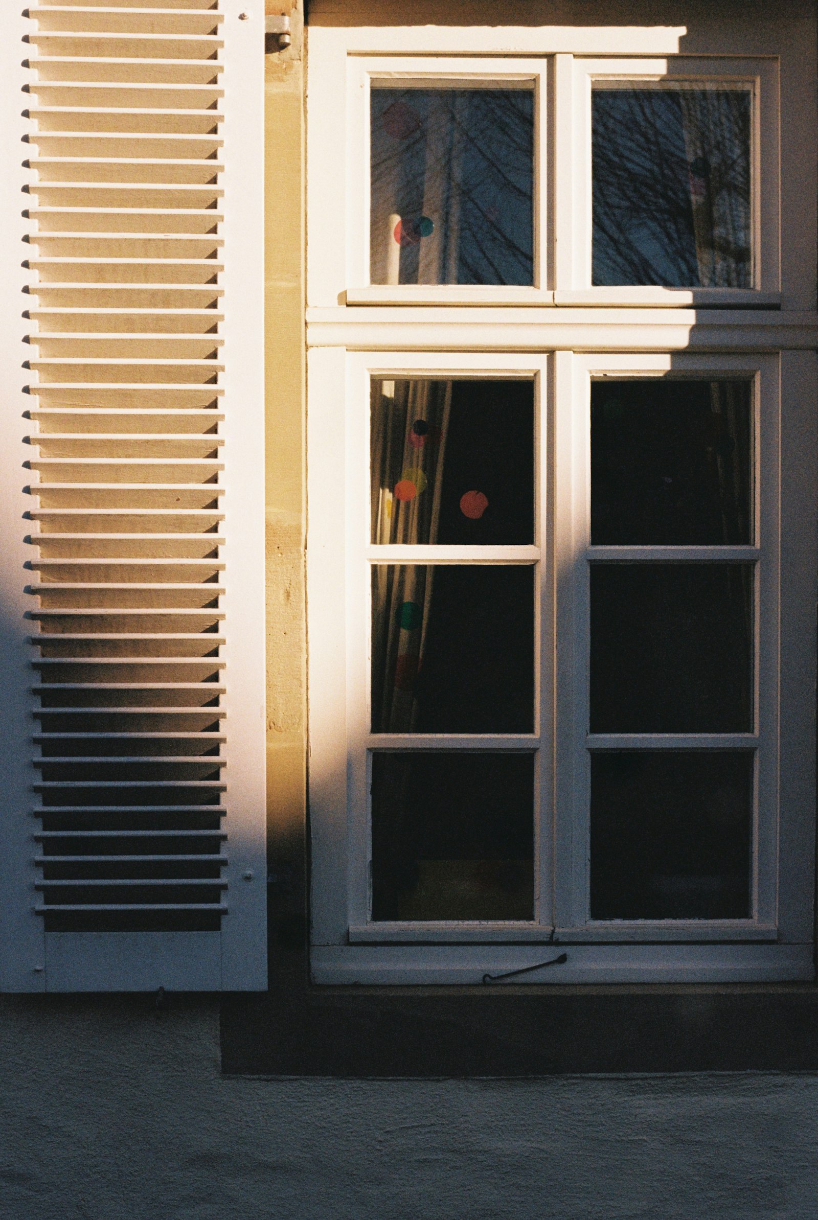 Traditional shutters on a quiet stone building